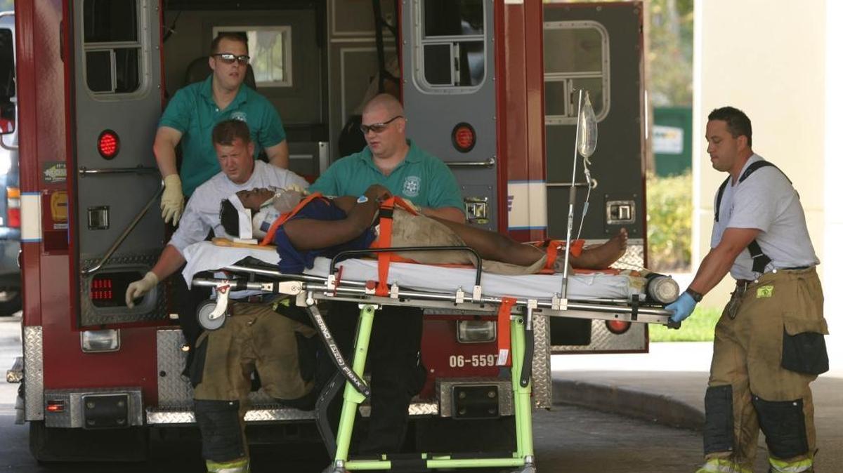 Paramedics in Fort Lauderdale bring a rescued driver to a trauma unit in Broward.