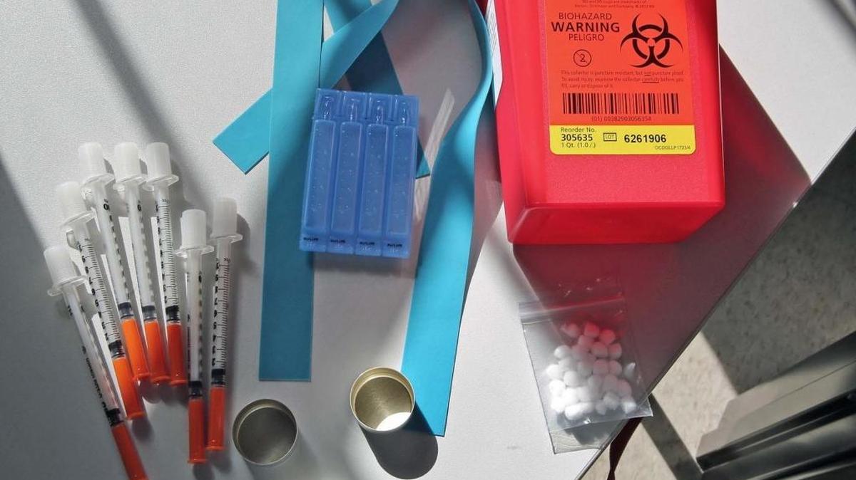 The University of Miami's needle exchange care package includes needles, water, boiling caps, cotton, rubber band and a disposal container.