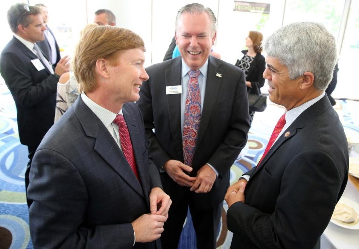 Agriculture Commissioner Adam Putnam speaks with Bob Swindell, with the Greater Fort Lauderdale Alliance and Jose Basulto, with Memorial Hospital System, at the Greater Fort Lauderdale Alliance Luncheon on May 15, 2017.