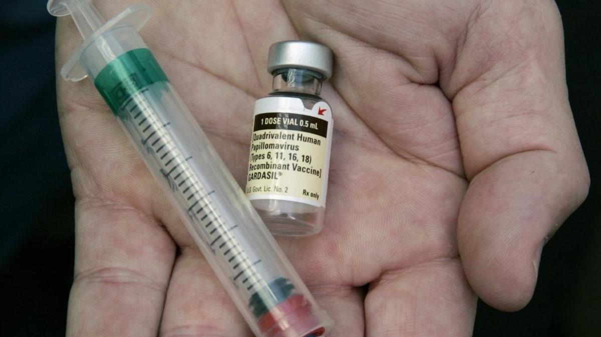 In this 2006 file photo, a doctor holds a vial of the human papillomavirus (HPV) vaccine Gardasil in his Chicago office.