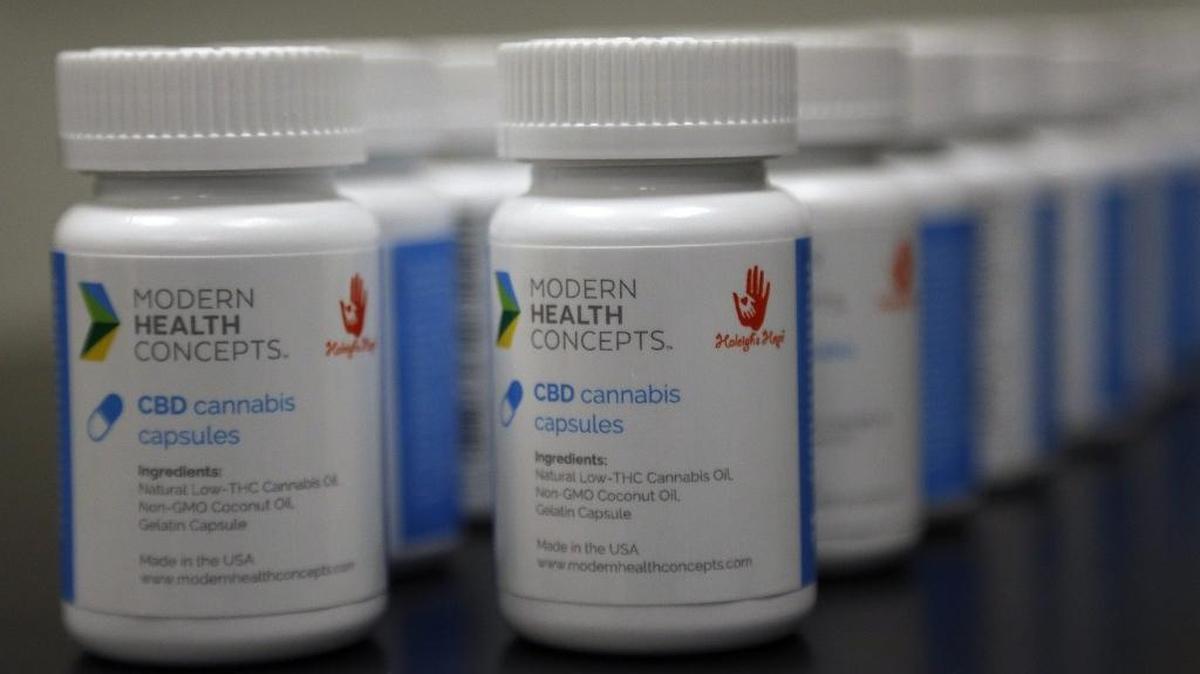 Bottles of cannabis capsules are lined up on the lab table of Modern Health Concepts, a South Florida dispensary for medical marijuana that is producing medicine inside its Redland lab on Tuesday, January 3, 2016.