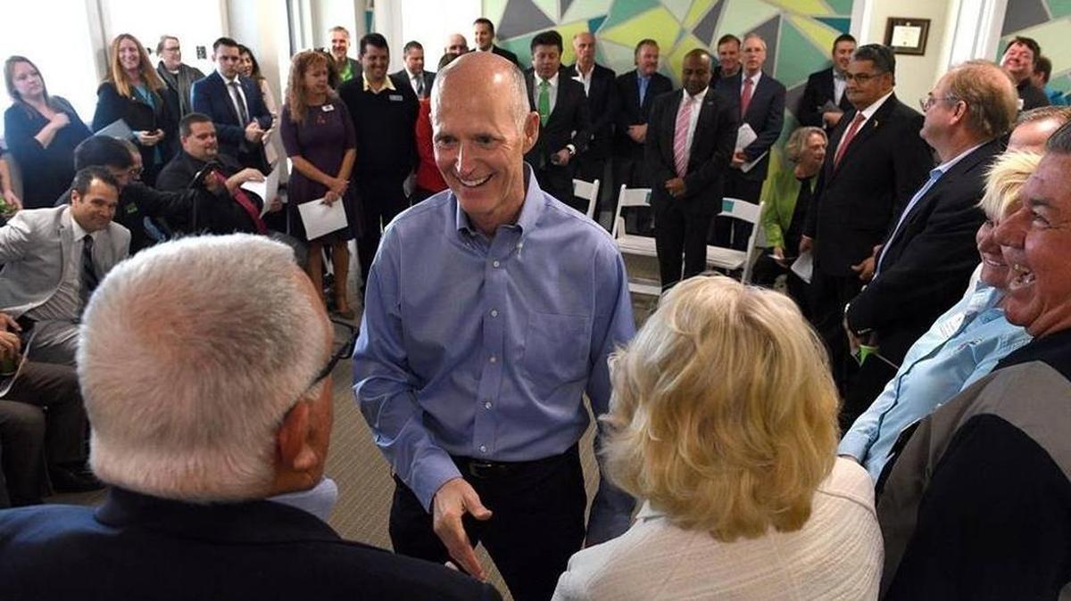 Gov. Rick Scott greets people March 16 as he hosts a jobs roundtable in Manatee County with business owners, economic development leaders, tourism leaders and community members.