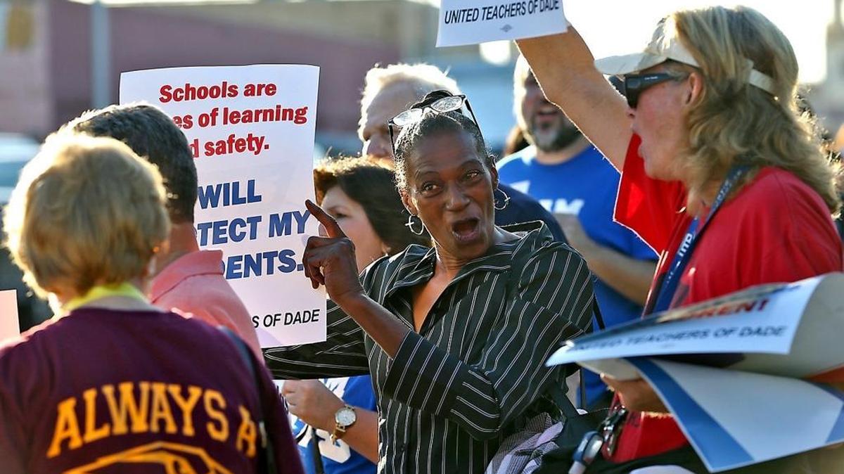 Paraprofessional Virginia Ducksworth (center) joins the United Teachers of Dade on Thursday, January 19, 2017, as the union took part in a nation-wide protest calling on the Senate to reject Betsy DeVos as Secretary of Education.