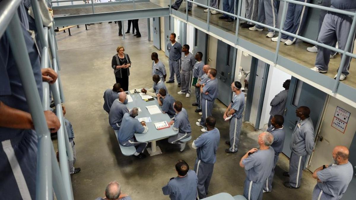 Florida Department of Corrections Secretary Julie Jones visits with Wakulla Correctional Institution inmates Tuesday morning, March 8, 2016, during a visit to the Betterment Dorm at the Crawfordville facility.