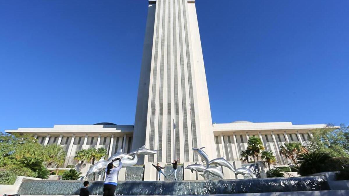 Visitors snap pictures outside Florida’s Capitol building in Tallahassee, Tuesday, January 16, the first day of the 2016 Florida legislative session.