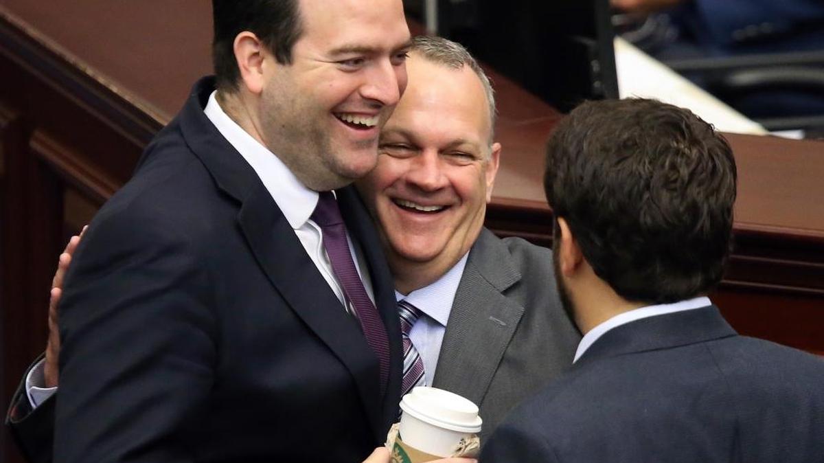 Rep. Jose Diaz, R-Miami, left, and Rep. Manny Diaz, R-Hialeah, share a moment with House Speaker Richard Corcoran, R-Land O’Lakes, center, before the start of session, Friday, June 9, 2017, in Tallahassee.