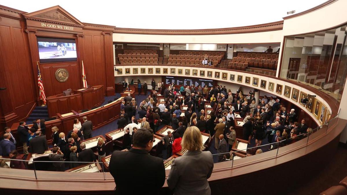 Visitors, Florida Senators and their staff members look at the new Florida Senate chamber, Monday, Nov. 21, 2016. The $6 million renovation took 8 months to complete.