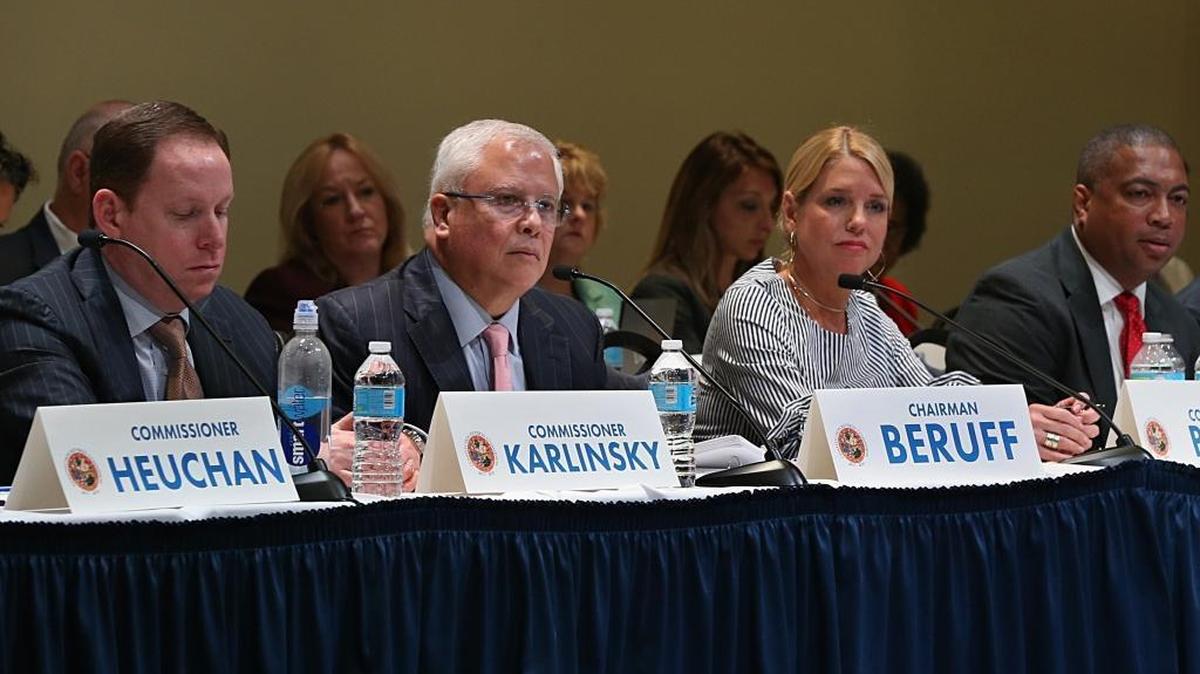 Chairman Carlos Beruff, center, is flanked by Commissioner Fred Karlinsky and Attorney General Pam Bondi as members of the Constitutional Revision Commission listen to residents during a town hall meeting with at Florida International University in Miami, April 6, 2017.