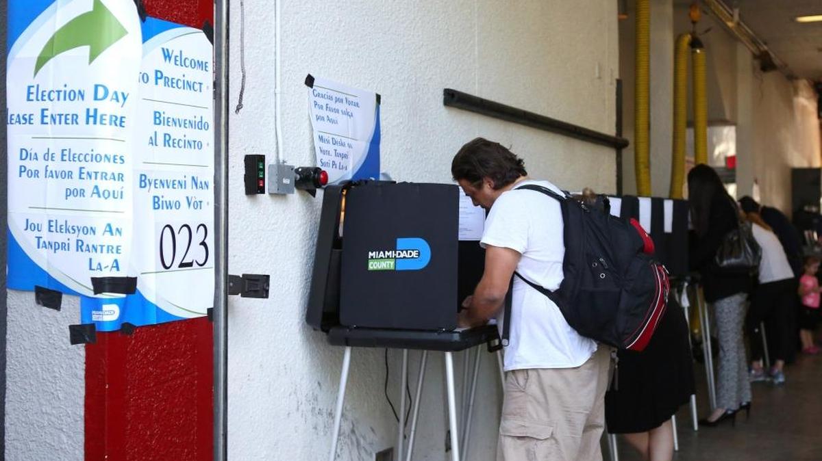 A man casts his vote at Miami Beach Fire Station No. 3, during the general election, November 8, 2016.