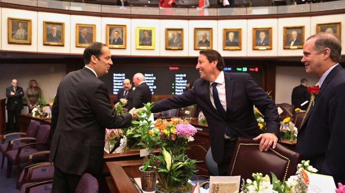 Florida Senate President Joe Negron, R-Stuart, shakes hands with Sen. Bill Galvano, R-Bradenton, on Tuesday, March 7, the first day of the 2017 legislative session.