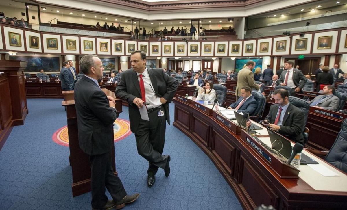 Sen. Tom Lee, right, R-Brandon, talks with Speaker of the House Richard Corcoran, R-Land O’Lakes, on the House floor during late negotiations Friday May 5, 2017, at the Capitol in Tallahassee.