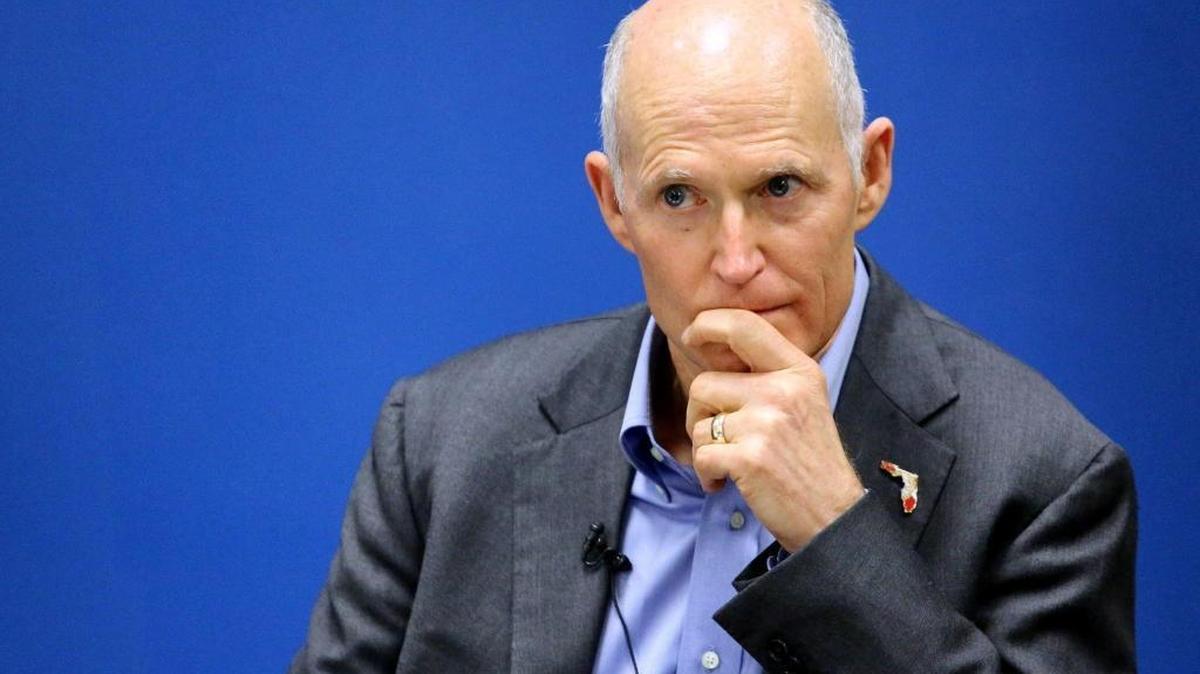 Gov. Rick Scott listens during a roundtable discussion in Kissimmee in November about the influx to the Orlando area of Puerto Rico residents affected by Hurricane Maria.