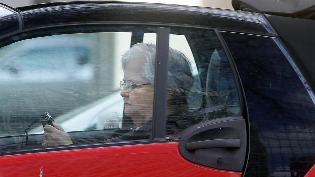 A driver texts as she makes her way through traffic in Dallas, Monday, March 6, 2017.