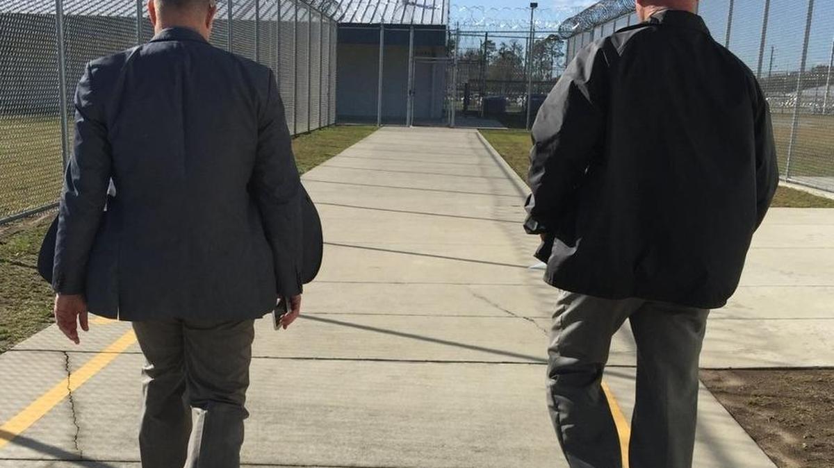 State Rep. David Richardson, D-Miami Beach, left, walks with the former warden at Suwannee Correctional, Thomas Reid. This was one of Richardson’s many unannounced inspections of a Florida prison.