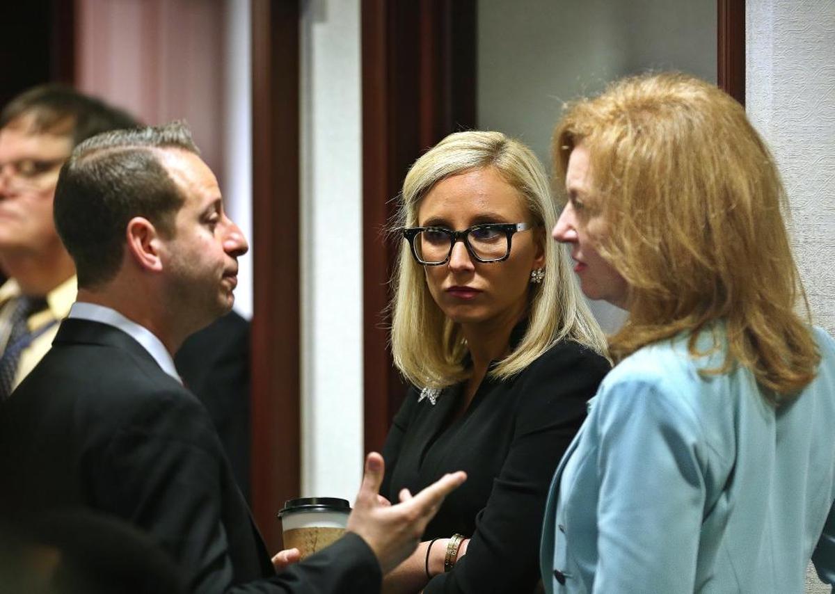 During questions from lawmakers on the gun and school safety bill in the Florida House, Rep. Jared Moskowitz, D-Coral Springs, left, Senator Lauren Book, D-Plantation, center, and Rep. Kristin Jacobs, D-Coconut Creek, talk on the floor of the House, at the Capitol in Tallahassee, Tuesday, March 6, 2018.