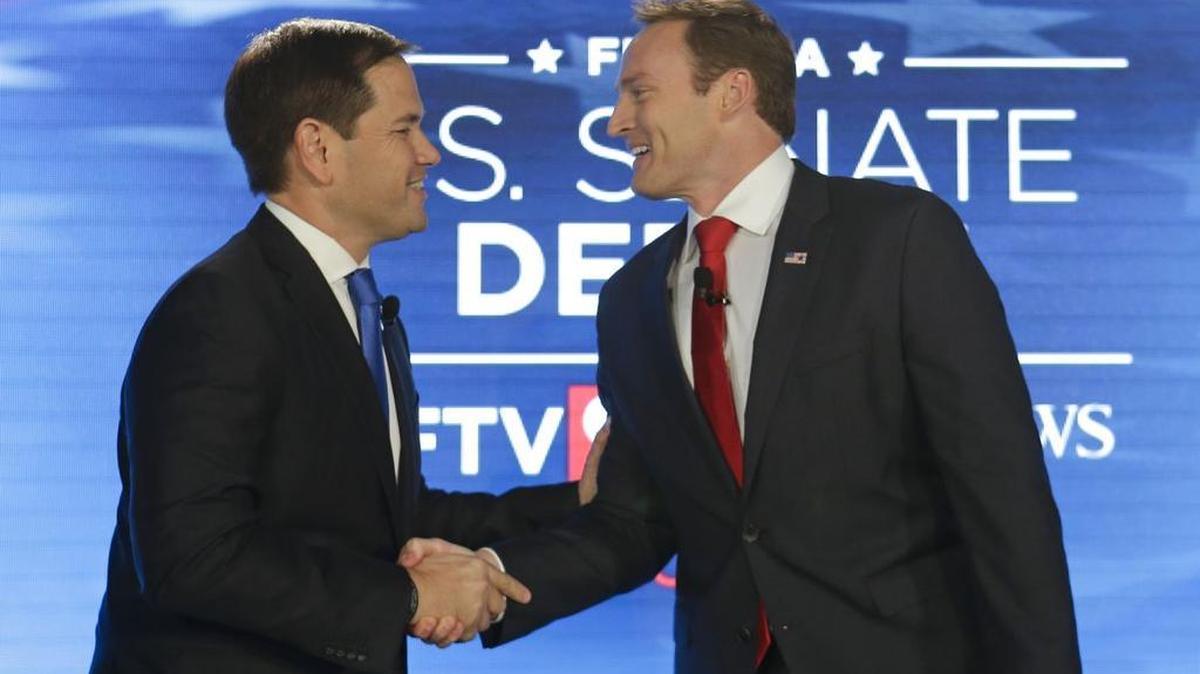Sen. Marco Rubio, R-Fla., left, and Rep. Patrick Murphy, D-Fla., shake hands before their debate at the University of Central Florida, Monday, Oct. 17, 2016, in Orlando, Fla.