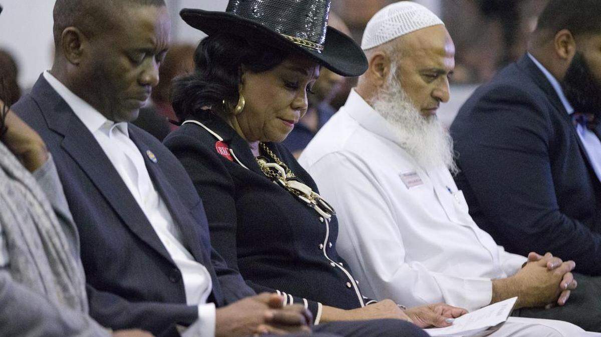 Rep. Frederica Wilson, D-Fla., center, is joined by Miami-Dade County Commissioner Jean Monestime, left, and businessman Abdul Razzak Khanani, right, during a prayer vigil before watching President Donald Trump's State of the Union at the Historic Greater Bethel AME Church, Tuesday, Jan. 30, 2018, in Miami.