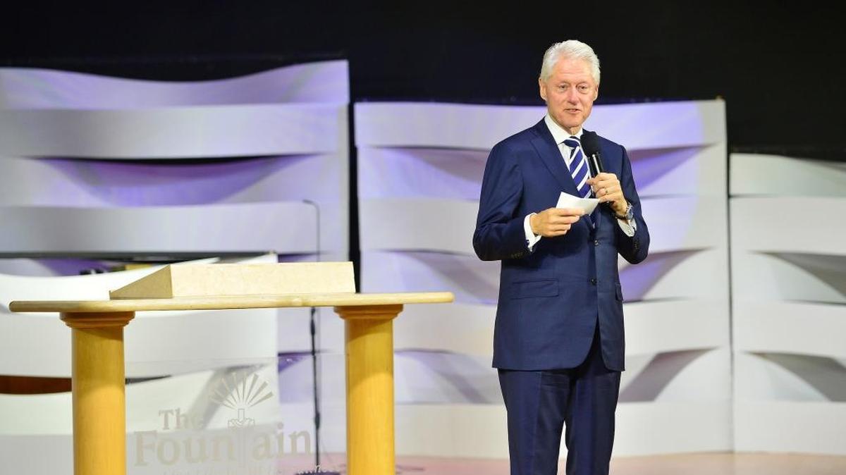 Former President Bill Clinton speaks at the Fountain of New Life Church on Sunday in Miami Gardens.