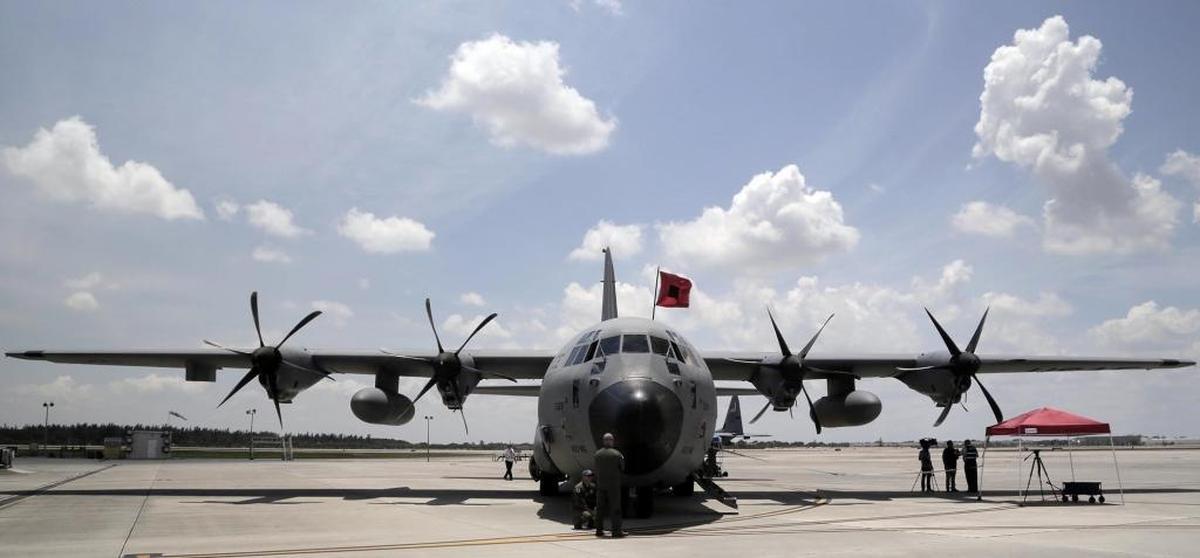 A U.S. Air Force C-130 hurricane hunter plan sits on the tarmac at Opa-locka Airport's US Coast Guard Air Station Miami, where school children, reporters and other toured the plane Friday.
