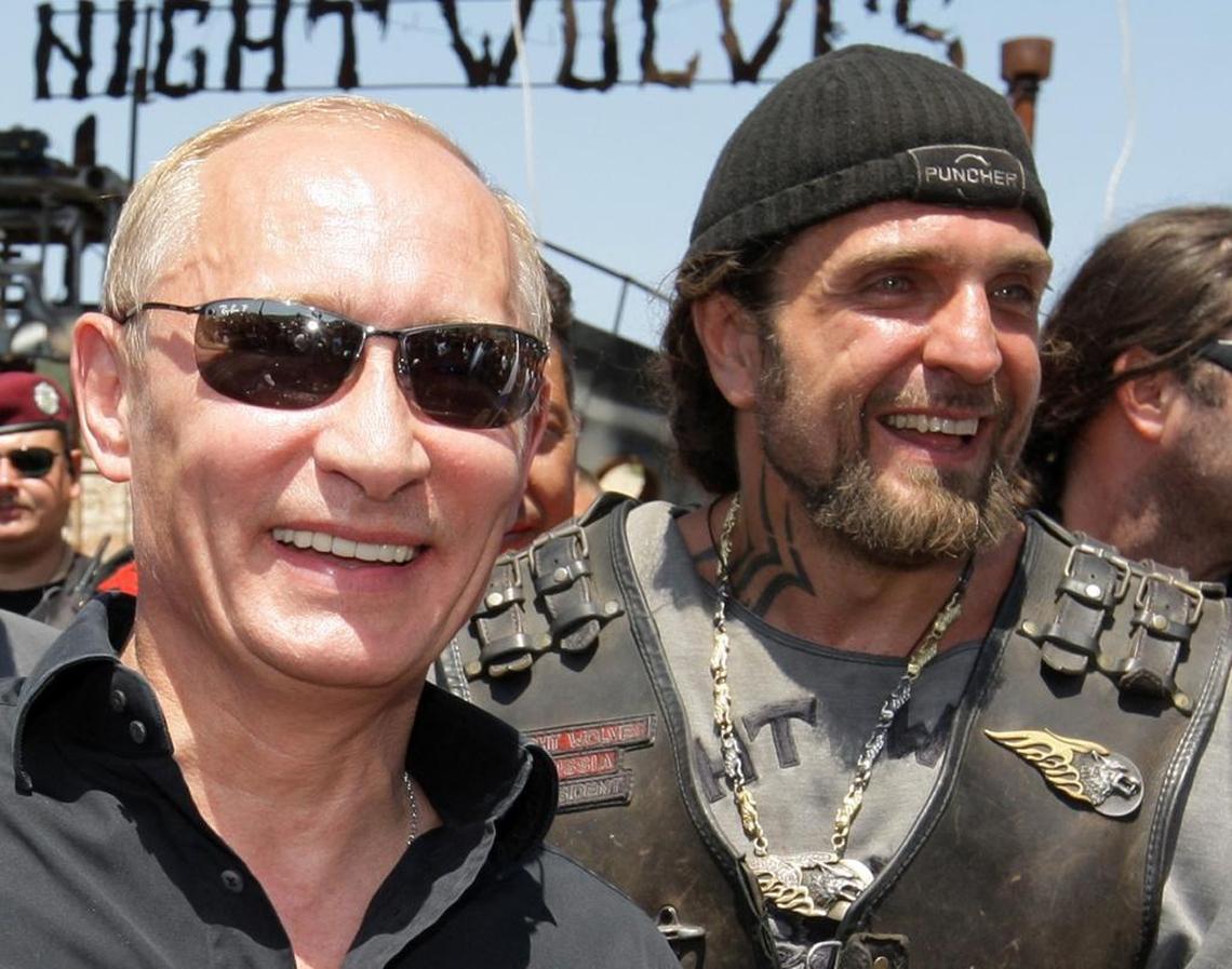 Vladimir Putin (L), then Russia's Prime Minister, walks side by side with Alexander Zaldostanov (R), nicknamed "the Surgeon", the leader of the group of Russian bikers called the Night Wolves, near Sevastopol in Ukraine's Crimea, in 2010.