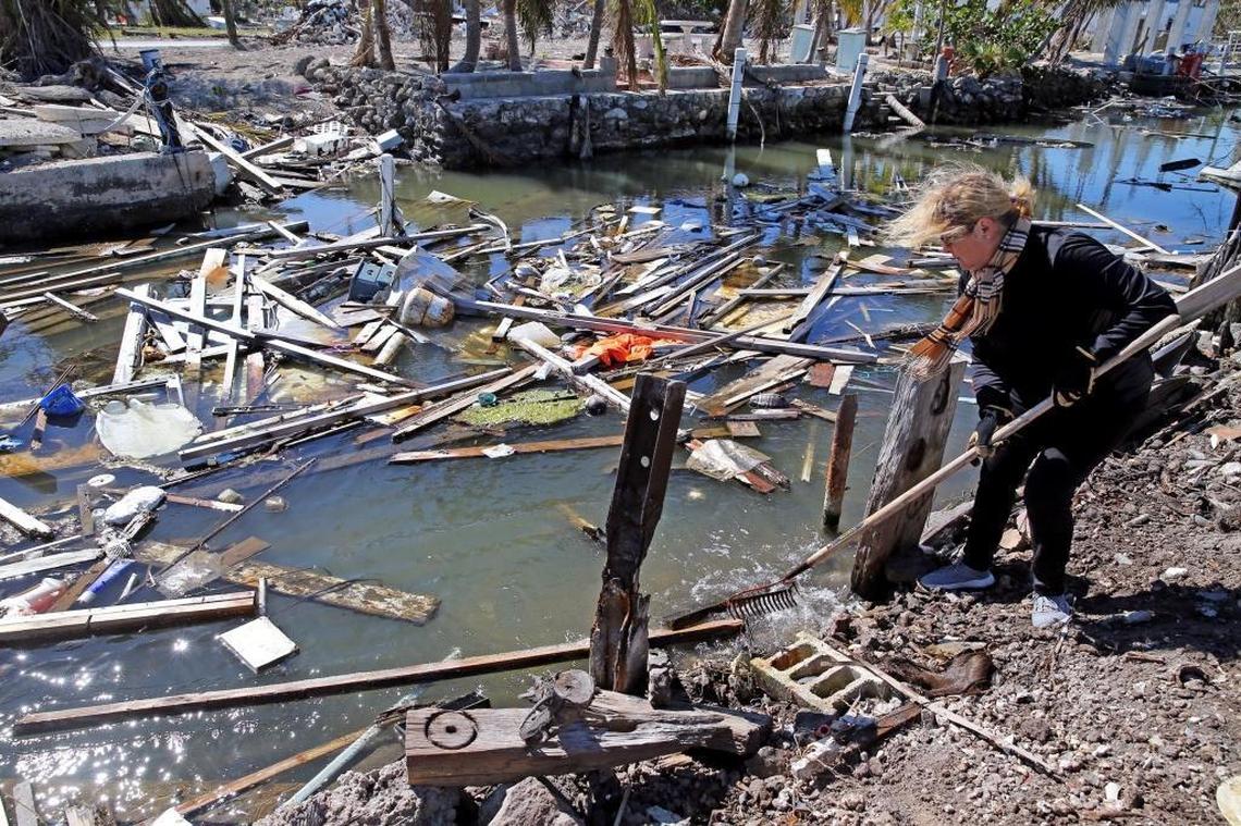 Paula Rybacki cleans the canal near her home on Big Pine Key in the Florida Keys, January 18, 2018. Debris from Hurricane Irma filled the canals in the middle keys causing navigation problems and an unsightly view from the homes located on the canals.