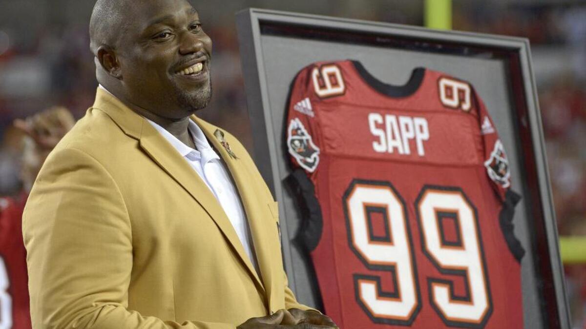 Warren Sapp smiles after being inducted into the Buccaneers’ Ring of Honor in 2013.