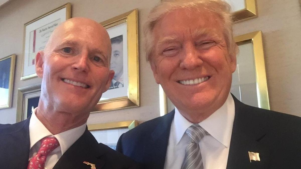 Florida Gov. Rick Scott poses for a selfie with President-elect Donald Trump during their meeting at Trump Tower in New York on Thursday.
