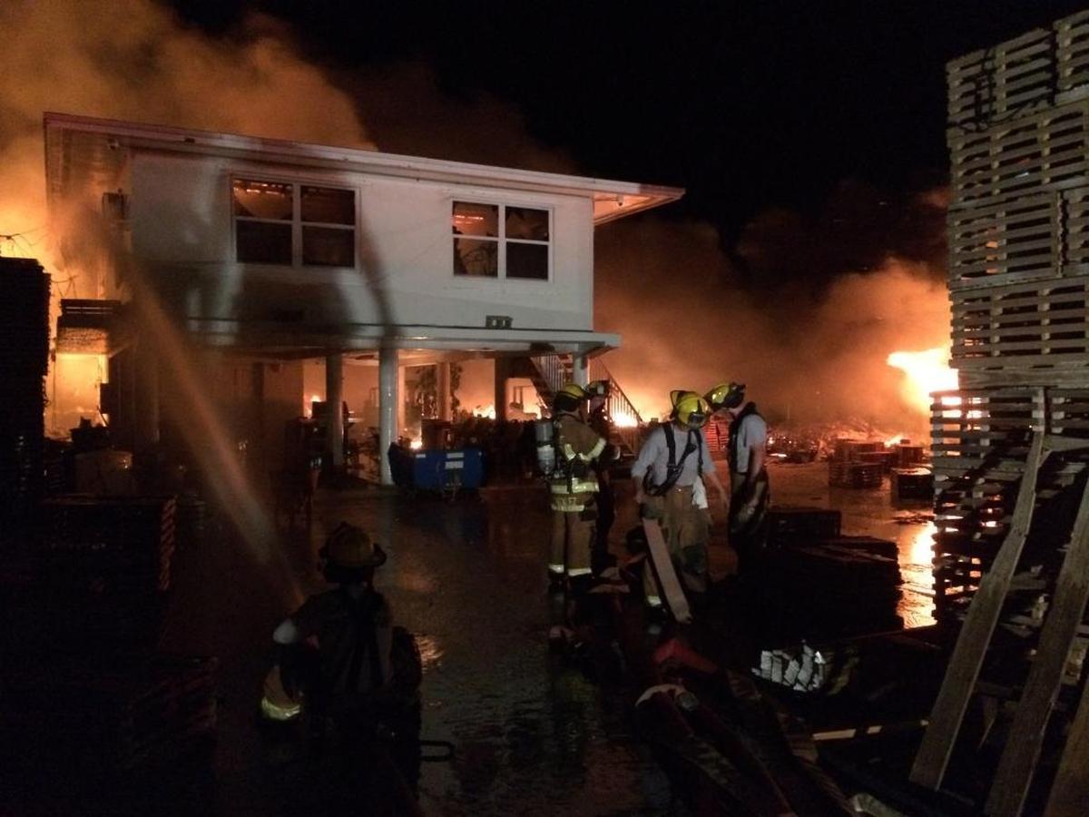 A major fire early Monday at a Marathon marina consumed a house and a lot filled with wooden lobster traps.