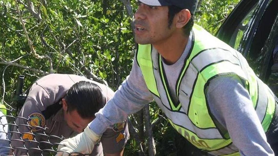 Leonardo Moreno is the Key Largo Volunteer Fire Department firefighter who became seriously ill trying to save the lives of four utility workers trapped in a drainage hole in Key Largo on Monday, Jan. 16. He is pictured here helping Florida Highway Patrol Sgt. Pedro Reinoso prepare a man suffering serious medical issues to board an ambulance on Aug. 5, 2015. The man passed out and crashed his pickup truck through a fence on the 18-Mile Stretch.