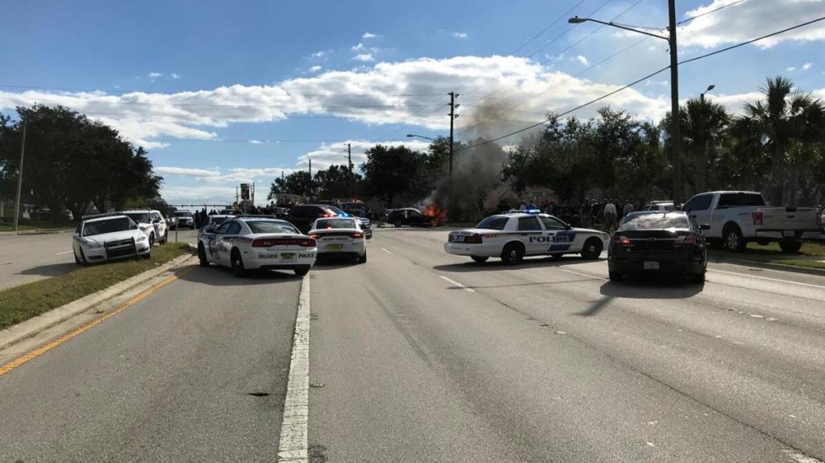 Orlando police flooded the area of Kirkman Road near West Robinson Street after one of the vehicles involved in a shootout crashed into another vehicle.