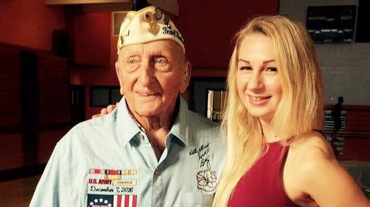 In a photo shortly before his death, Pearl Harbor survivor John Seelie and University of Miami architecture student Emi Kopke.