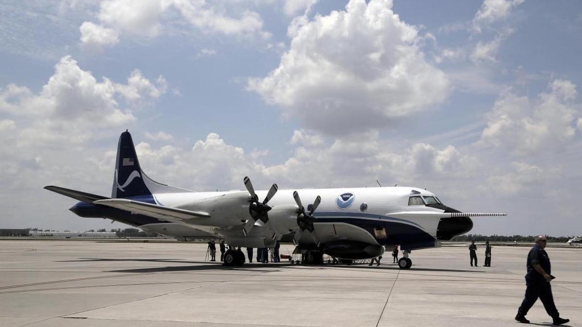 The National Oceanic and Atmospheric Administration’s hurricane hunter plane, nicknamed Kermit, sits on the tarmac at the Opa-locka airport Friday.