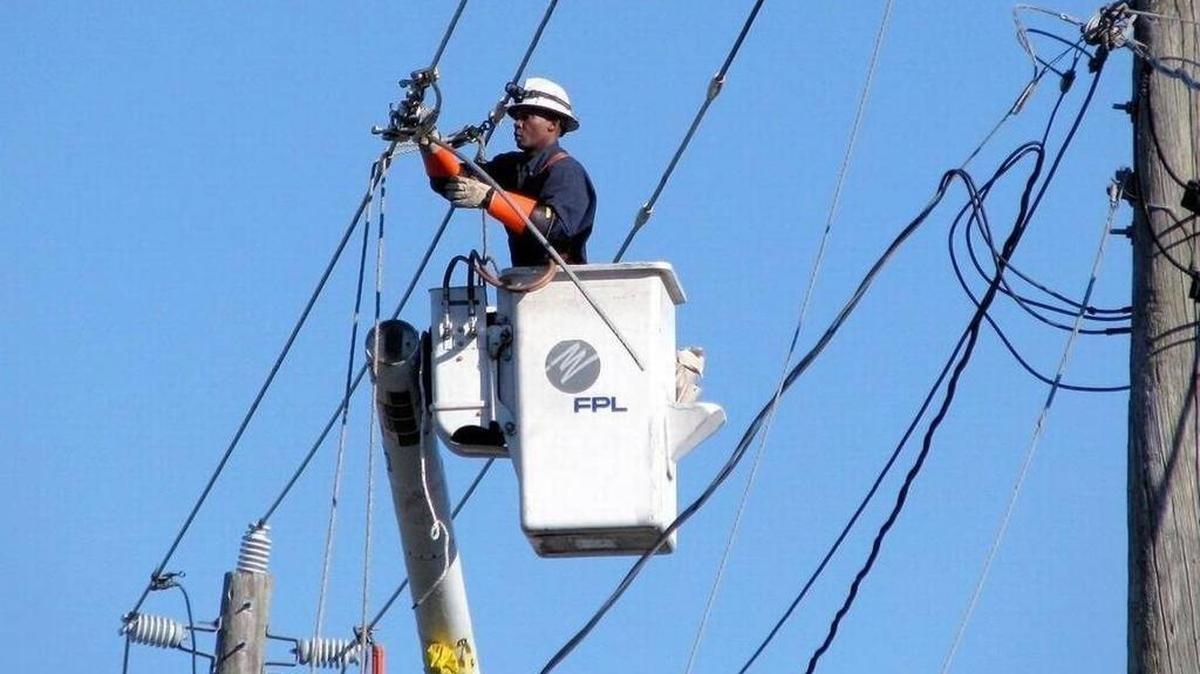 An FPL lineman repairs damage after Hurricane Irma in Miami. A jury ordered Florida Power & Light to pay $24 million to a Fort Myers mother whose son was electrocuted after climbing a bamboo stalk that touched high-voltage lines in 2011.