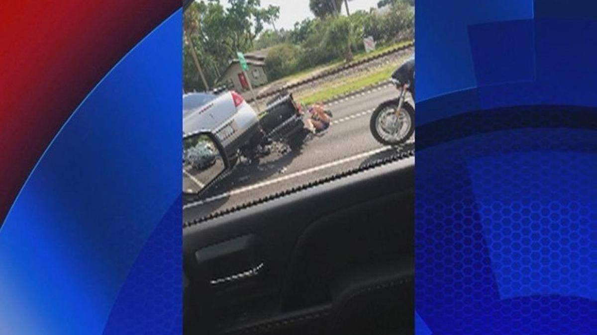According to troopers, cell phone video from a witness shows Robert Vance turning his silver sedan into a motorcycle on US 41 and County Line Road in Lutz Monday afternoon.