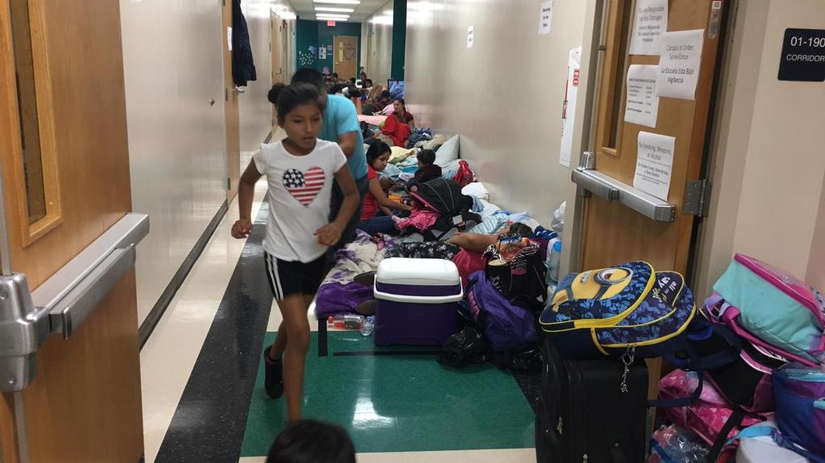 Children play in the halls of Prine Elementary School during evacuation for Hurricane Irma.