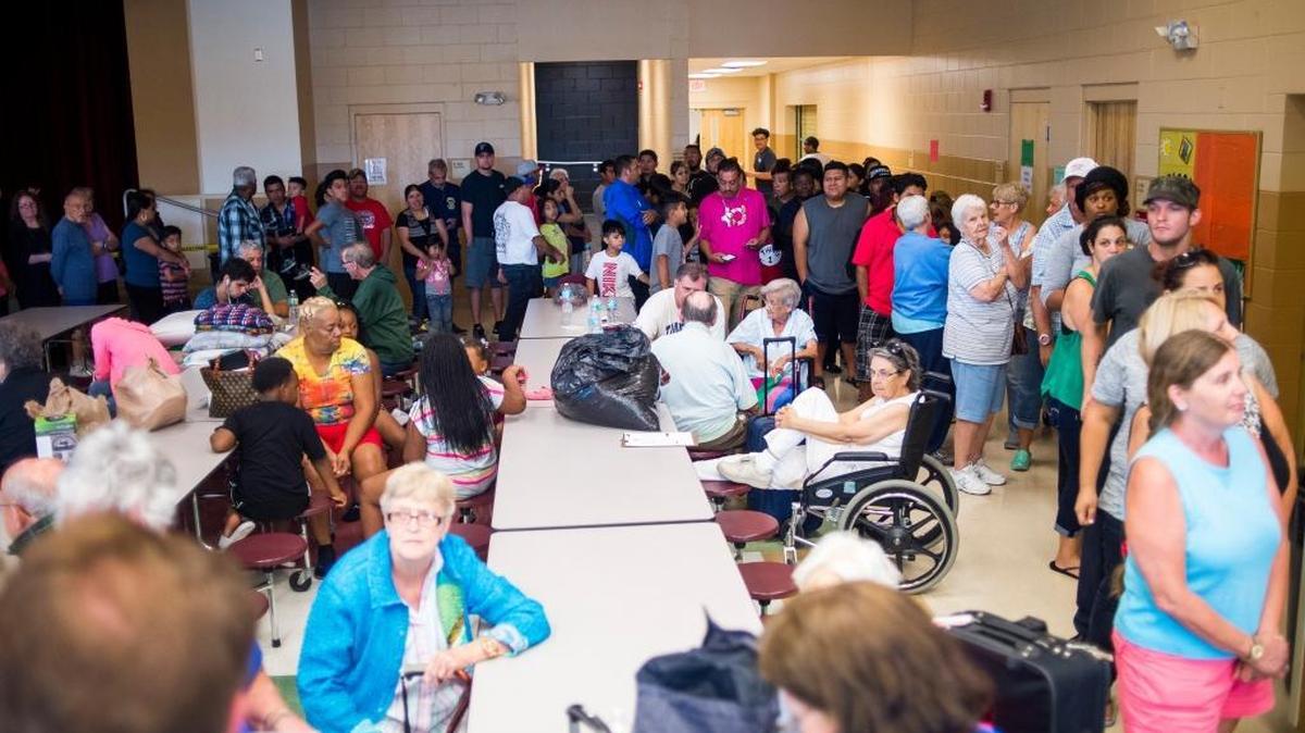 Evacuees stand in line for lunch at the Buffalo Creek Middle School shelter as Hurricane Irma slowly approaches Manatee County on the afternoon of Sept. 9 in Palmetto.