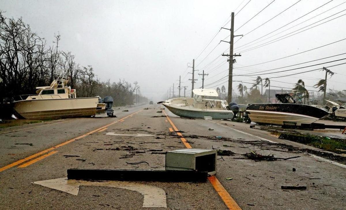 Boats block the Overseas Highway after Hurricane Irma surge tosssed debris, boats, cars, sheds and appliances onto the highway throughout the middle Keys, September 10, 2017.