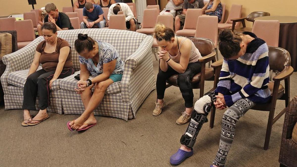 Residents at the Tropical Inn Resort, a hotel and rehab facility, have a moment of prayer in preparation of upcoming Hurricane Matthew on Thursday , October 6, 2016 residents.
