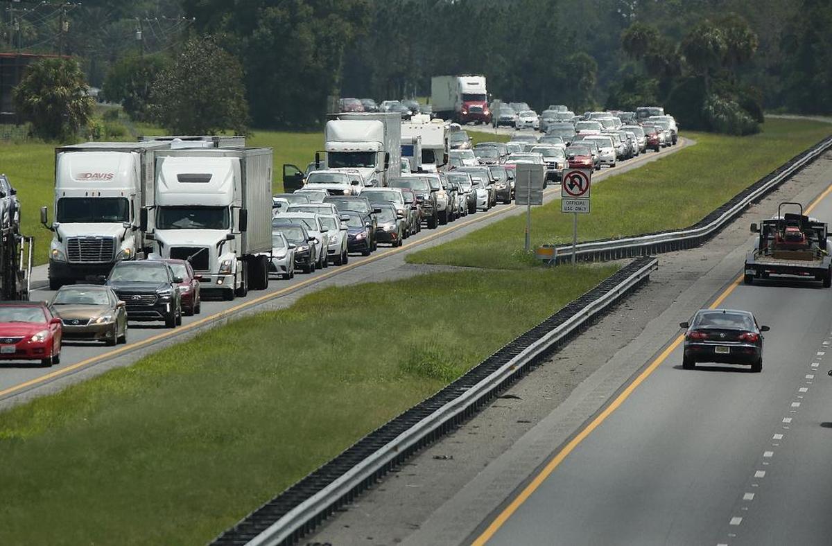 Traffic rolls at a crawl on the northbound lanes of Florida's Turnpike near the intersection of I-75 in Wildwood on Friday, September 8, 2017. Motorists fled the state ahead of Hurricane Irma.