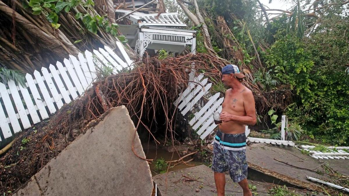 Robert Phillips looks at the former Key West house of poet and author Shel Silverstein, which was crushed by a falling tree as Hurricane Irma swept through, September 10, 2017.