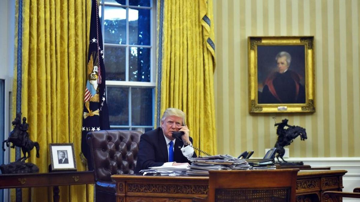 This file photo taken on January 28, 2017, shows US President Donald Trump speaking on the phone with Australia's Prime Minister Malcolm Turnbull from the Oval Office of the White House in Washington, DC.