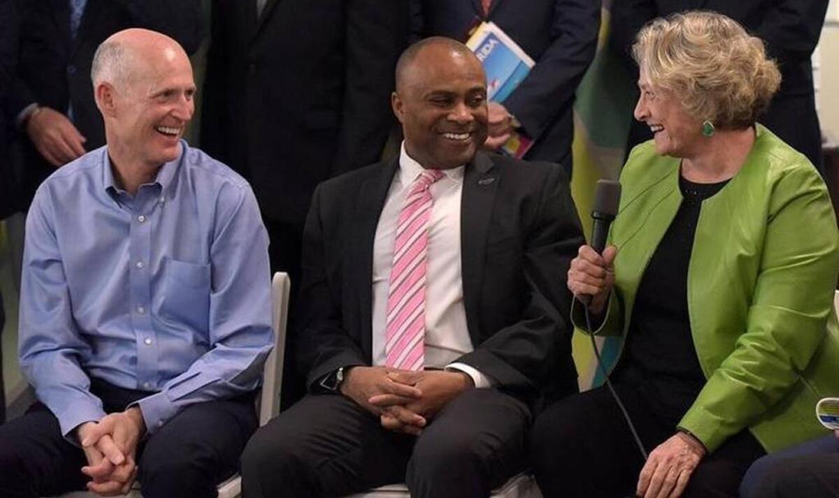 Ken Lawson, then the head of Visit Florida and now director of the Florida Department of Economic Opportunity, sits with Gov. Rick Scott, left and Nancy Detert as they participated in a Fighting for Florida Jobs Roundtable in Manatee County on March 16, 2017. Lawson has been in charge of the unemployment system that was put in place during Scott’s time as governor.