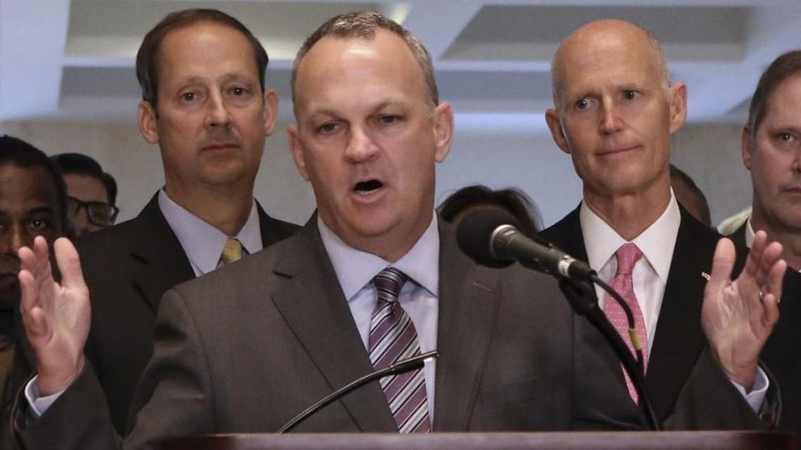 House Speaker Richard Corcoran and Gov. Rick Scott are pictured.