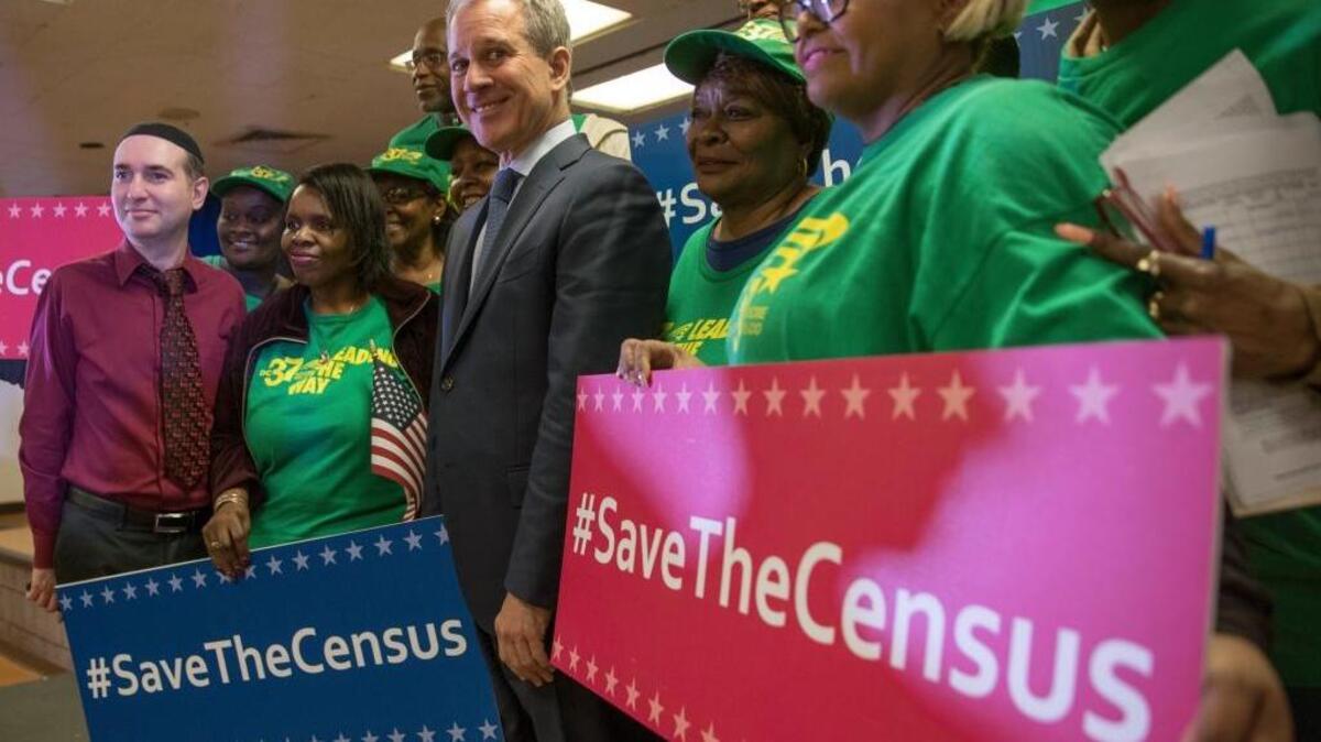 New York Attorney General Attorney General Eric Schneiderman poses for a photo with members of District Council 37 after a news conference, Tuesday, April 3, 2018, in New York. Schneiderman announced a new lawsuit by seventeen states, the District of Columbia and six cities against the U.S. government Tuesday, saying a plan to add a citizenship demand to the census questionnaire is unconstitutional.