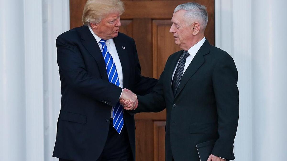 President-elect Donald Trump shakes hands with General James Mattis at the clubhouse of Trump International Golf Club, Nov. 19, in Bedminster Township, New Jersey.