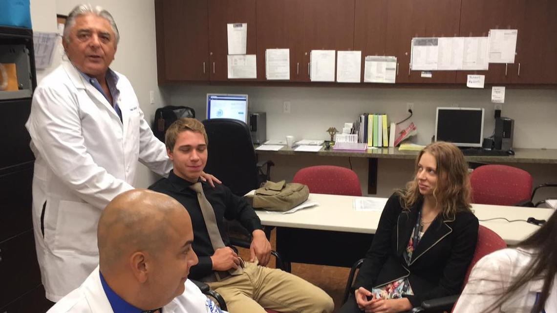 Turning Points’ new medical director, Dr. Ron Cirillo, second from left, speaks with, from left, Alejandro Vazquez of Lake Erie College of Osteopathic Medicine, Caleb Streitmatter of Riverview High School and Cassidy Nern of Sarasota Military Academy.