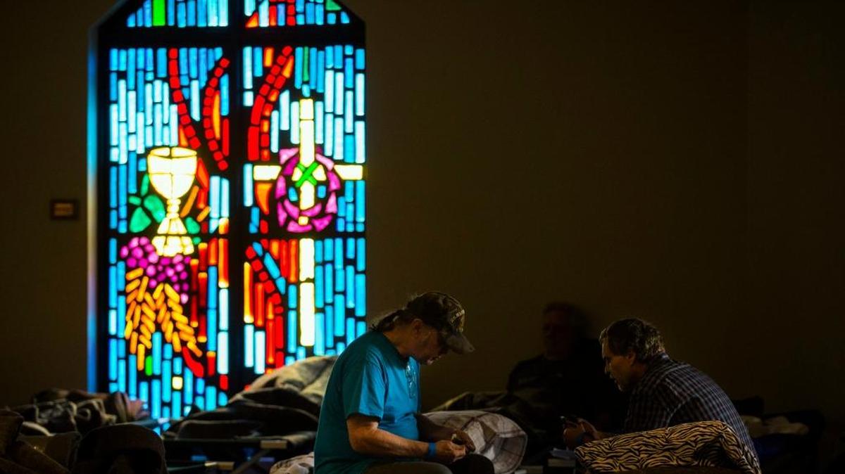 Evacuees rest on cots in a shelter at Woodcrest Church after their homes were damaged from rising flood waters due to Tropical Storm Harvey in Lumberton, Texas. With more than 17,000 people flooded out of their houses, big-hearted Texans, religious institutions and businesses have turned their places into unlikely shelters, offering soaked, frightened and disconsolate storm refugees , two-legged and four-legged alike, a safe and warm place to sleep.