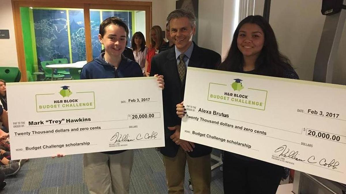 FILE: Trey Hawkins and Alexa Brutus received a $20,000 scholarship for their top-five finish in a nationwide budgeting competition involving over 71,000 students. Their teacher, Deane Western (center), said the challenge was very complex, involving several factors and daily decisions.