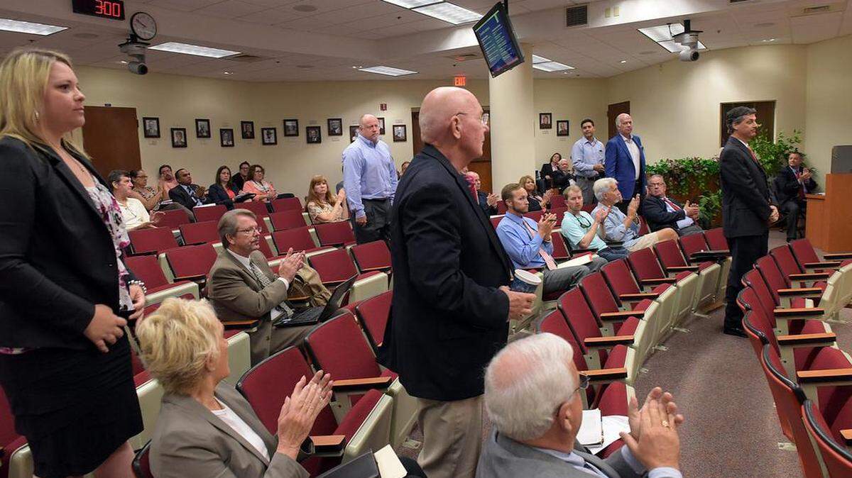 Members of the Citizens Financial Structure Advisory Board stand to be recognizes as they present a report to the Manatee County Commission Tuesday about a half-cent sales tax increase in the county. TIFFANY TOMPKINS/Bradenton Herald