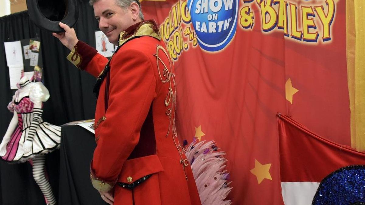 In this August 2016 file photo, Casey Rodgers, vice president of finance and strategic planning for Feld Entertainment, tips a top hat as he tries on a ringmaster's coat at the company's wardrobe department. Feld is one of 67 companies that has contracted with Manatee County for economic development incentives since 2009.